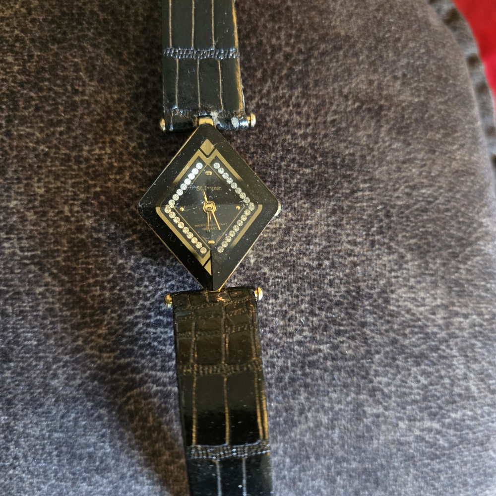 Black and Gold Watch with Diamond Accents